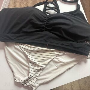 Calia swimsuit. Bottoms are a medium. Top is a large. Excellent used condition.